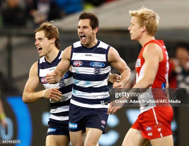 Daniel Menzel of the Cats celebrates a goal with Jake Kolodjashnij of the Cats during the 2017 AFL Second Semi Final match between the Geelong Cats...