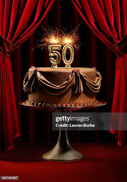birthday cake on stage with number 50 candles - cinquantième anniversaire de mariage photos et images de collection