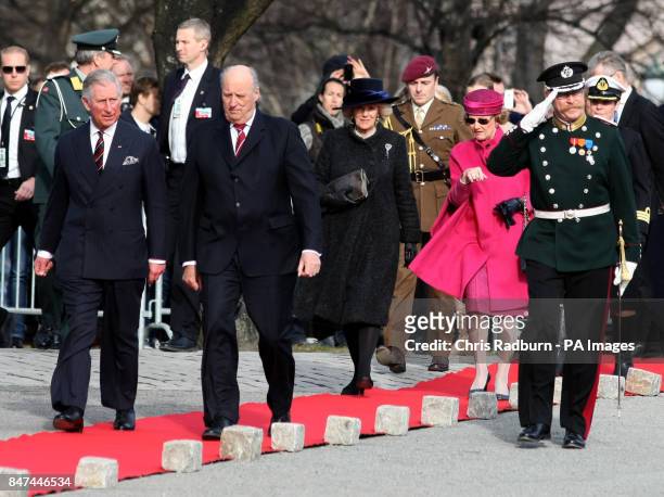 The Prince of Wales and King Harald of Norway are followed by the Duchess of Cornwall and Queen Sonja, during a wreath laying ceremony at the...