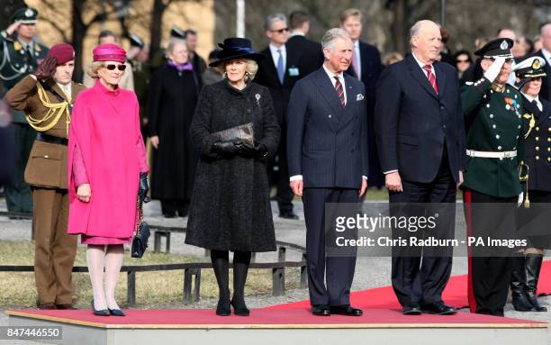 The Prince of Wales and Duchess of Cornwall are accompanied by King Harald and Queen Sonja of Norway, during a wreath laying ceremony at the National...