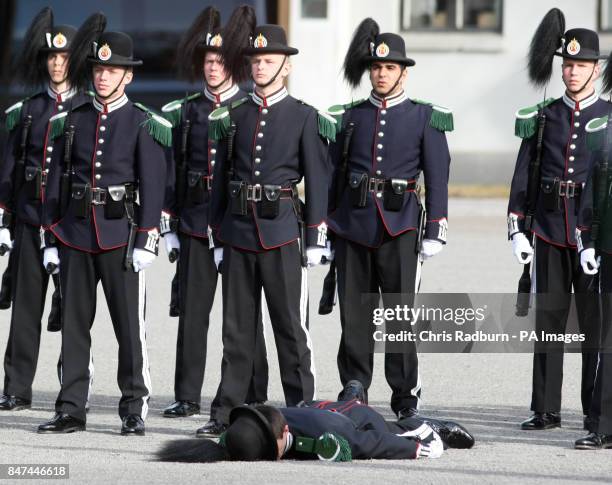 Serviceman from the Guard of Honor faints before the arrival of The Prince of Wales and The Duchess of Cornwall, at a wreath laying ceremony at the...