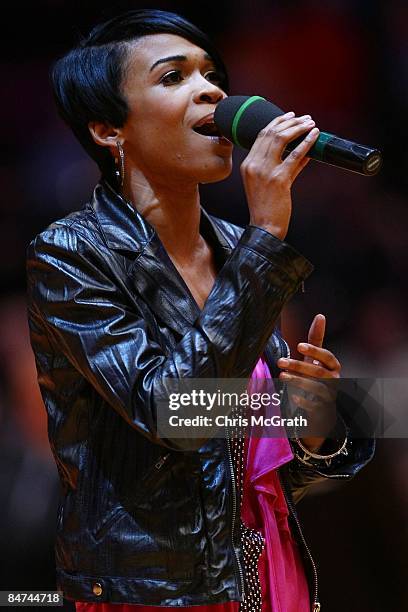 Singer Michelle Williams sings the national anthem during the game between the Boston Celtics and the New York Knicks at Madison Square Garden...