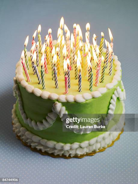 birthday cake with many candles - birthday cake candles stock pictures, royalty-free photos & images