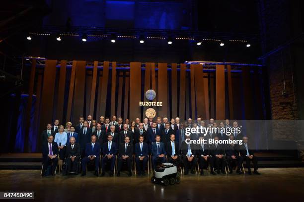 Participants sit for a photograph following the Eurogroup meeting in Tallinn, Estonia, on Friday, Sept. 15, 2017. "The monetary union is the core of...