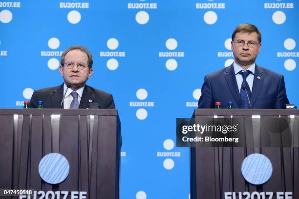 Vitor Constancio, vice president of the European Central Bank , left and Valdis Dombrovskis, vice president of the European Commission, listen during...