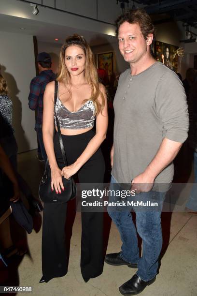 Hana Nitsche and Jason Conrad attend IV New York Gallery Grand Opening Exhibition on September 14, 2017 in New York City.