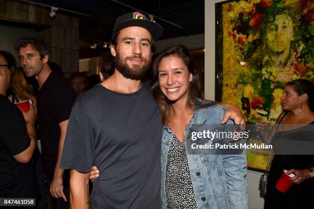 Brian Britt and Caitlin Cotroneo attend IV New York Gallery Grand Opening Exhibition on September 14, 2017 in New York City.