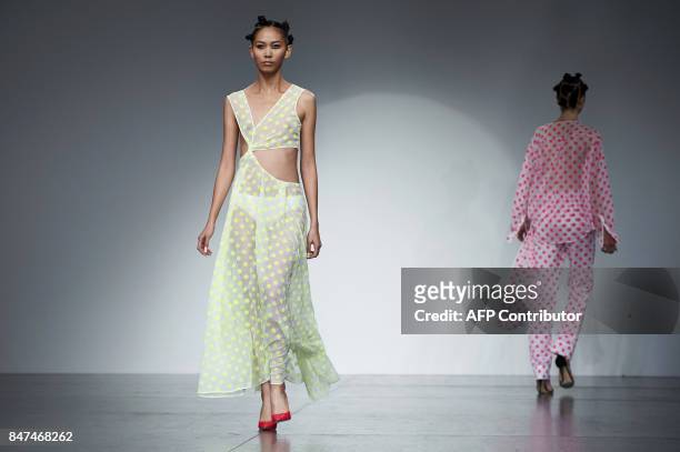 Models present creations by Polish born designer Marta Jakubowski during a catwalk show for her Spring/Summer 2018 collection on the first day of...