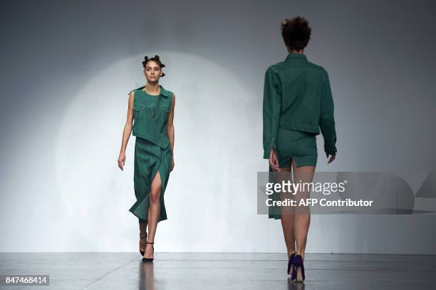 Models present creations by Polish born designer Marta Jakubowski during a catwalk show for her Spring/Summer 2018 collection on the first day of...