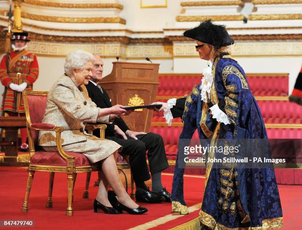 Queen Elizabeth II accompanied by the Duke of Edinburgh receives a copy of the loyal address from the City of Westminster Councillor Susie Burbidge,...