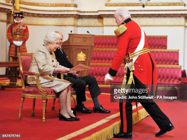 Queen Elizabeth II accompanied by the Duke of Edinburgh receives a copy of the loyal address from the military Knights of Windsor Maj Gen Sir Michael...