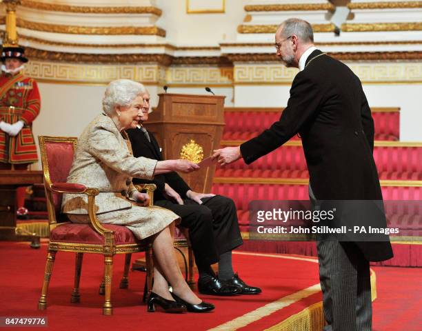 Queen Elizabeth II accompanied by the Duke of Edinburgh receives a copy of the loyal address from the Royal Academy of arts President Christopher Le...