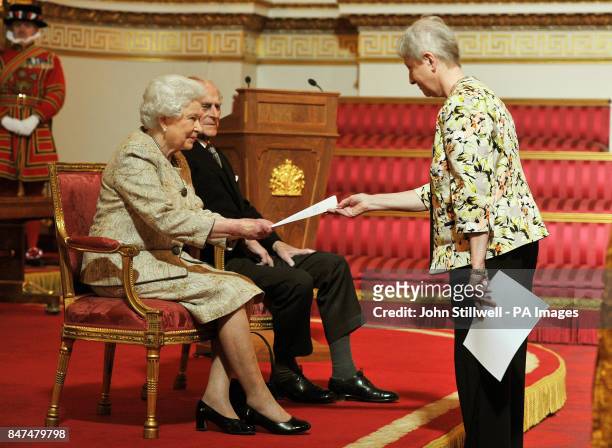 Queen Elizabeth II accompanied by the Duke of Edinburgh receives a copy of the loyal address from the loyal address from the Quakers Society Joycelin...