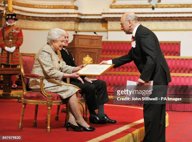 Queen Elizabeth II accompanied by the Duke of Edinburgh receives a copy of the loyal address from the Anglo-jewish Association President Vivian...