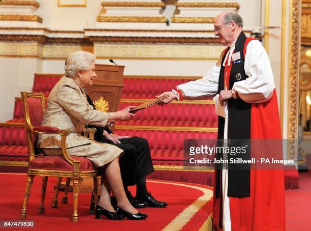 Queen Elizabeth II accompanied by the Duke of Edinburgh receives a copy of the loyal address from the Dean and Canons of St George's Chapel Windsor...