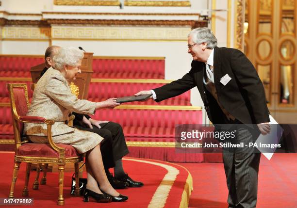 Queen Elizabeth II accompanied by the Duke of Edinburgh receives a copy of the loyal address from the Governor of the Bank of England Sir Mervyn...