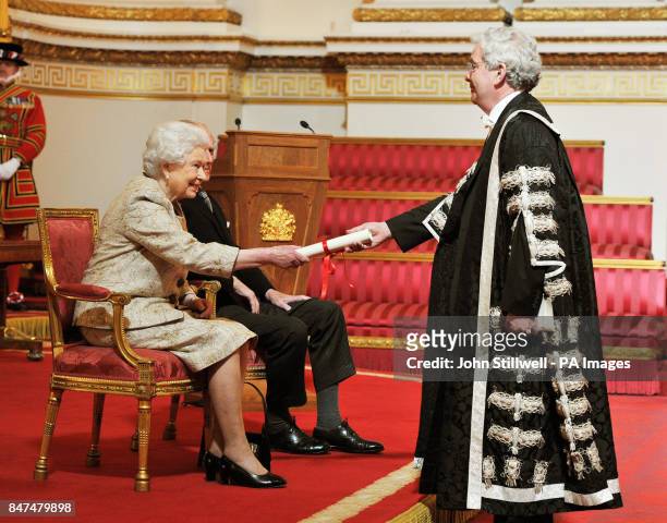 Queen Elizabeth II accompanied by the Duke of Edinburgh receives a copy of the loyal address from the Vice Chancellor of Edinburgh University Sir Tim...