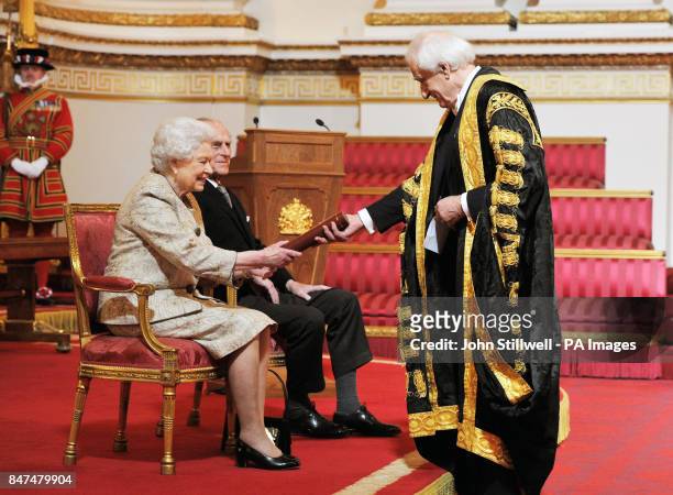Queen Elizabeth II accompanied by the Duke of Edinburgh receives a copy of the loyal address from the University of Aberdeen Chancellor Lord Wison of...
