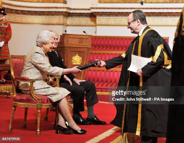 Queen Elizabeth II accompanied by the Duke of Edinburgh receives a copy of the loyal address from the University of London Vice Chancellor Professor...