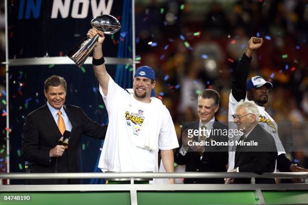 Quarterback Ben Roethlisberger of the Pittsburgh Steelers hoists the Lombardi Trophy after his team's 27-23 victory over the Arizona Cardinals during...