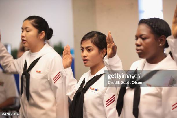 Sailors, currently serving in the U.S. Navy at Naval Station Great Lakes, take the Oath of Allegiance to become a U.S. Citizen on September 15, 2017...