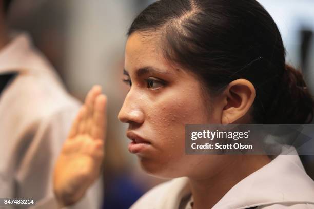 Camila Tenorio, who has lived in the United States since she was 18 months old and is currently serving in the U.S. Navy, takes the Oath of...