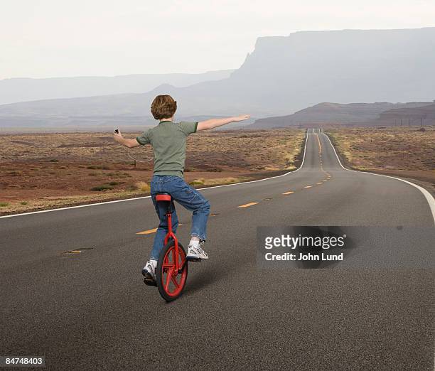 freedom ride - unicycle stock pictures, royalty-free photos & images