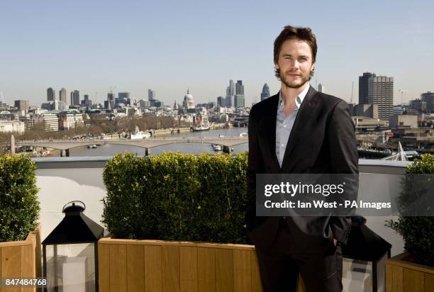 Taylor Kitsch is seen at a photocall for new film Battleship at the Corinthia Hotel in London.