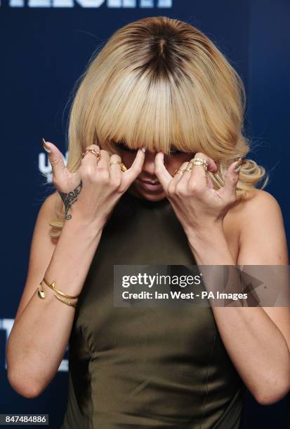 Rihanna is seen at a photocall for new film Battleship at the Corinthia Hotel in London.