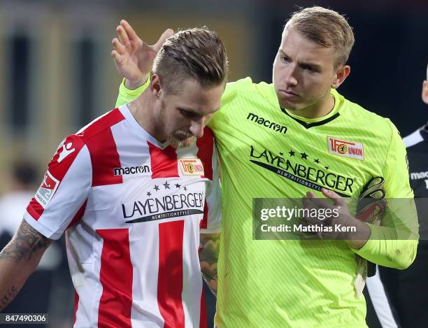 Jakob Busk of Berlin talks with team mate Sebastian Polter after the Second Bundesliga match between 1. FC Union Berlin and Eintracht Braunschweig at...