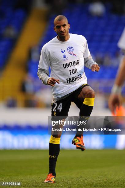 Bolton Wanderers' Darren Pratley warms up wearing a t-shirt in support of teammate Fabrice Muamba