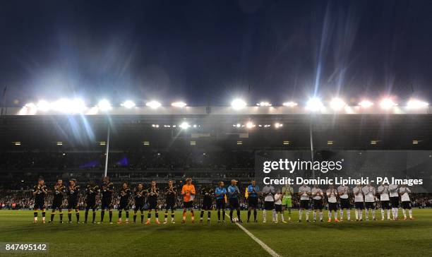 Tottenham Hotspur and Bolton Wanderers players applaud the medical staff who treated Fabrice Muamba before kick off