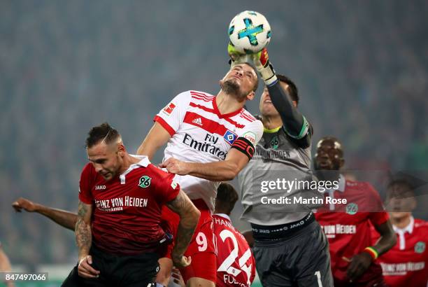 Marvin Bakalorz of Hannover and Kyriakos Papadopoulos of Hamburg head for the ball during the Bundesliga match between Hannover 96 and Hamburger SV...