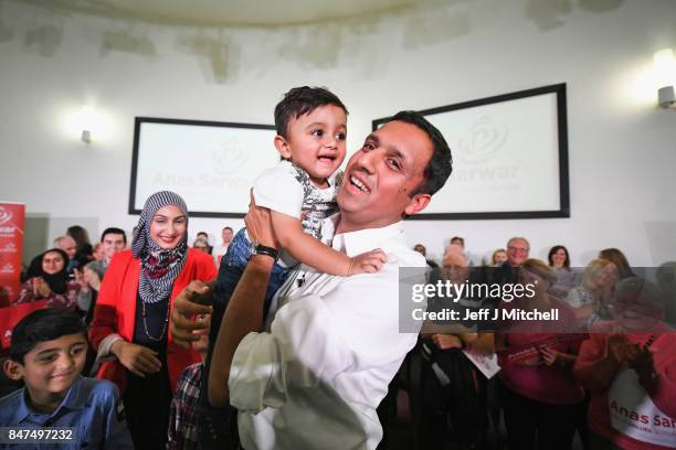 Anas Sarwar is seen on stage with his family at the launch of his campaign to be Scottish Labour leader at the Gorbals Parish Church on September 15,...