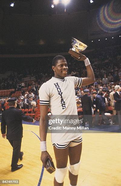 Big East Tournament: Georgetown Patrick Ewing victorious after accepting MVP trophy of tournament after win vs Syracuse. New York, NY 3/10/1984...