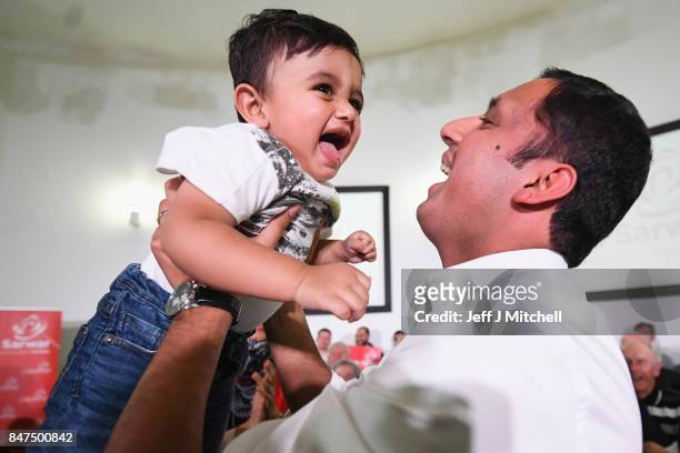 Anas Sarwar is seen on stage with his family at the launch of his campaign to be Scottish Labour leader at the Gorbals Parish Church on September 15,...