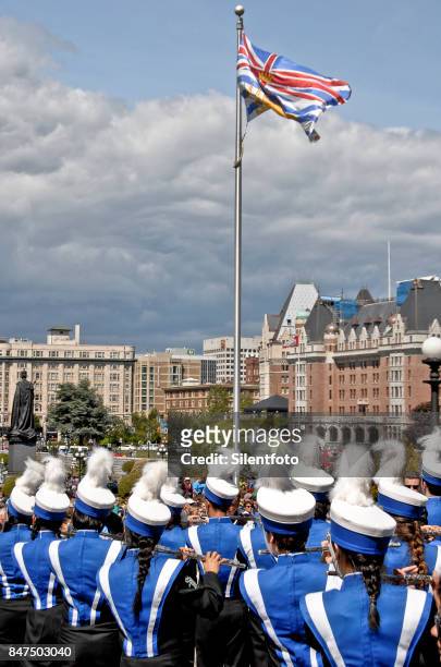 victoria day parade school marching band under flag - victoria harbour vancouver island stock pictures, royalty-free photos & images