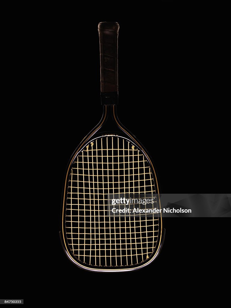 Racquetball racquet on black background