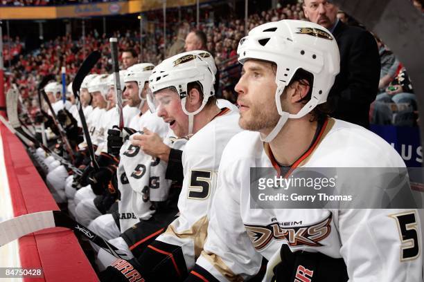 Steve Montador and teammates of the Anaheim Ducks watch the game on the bench in between shifts against the Calgary Flames on February 7, 2009 at...