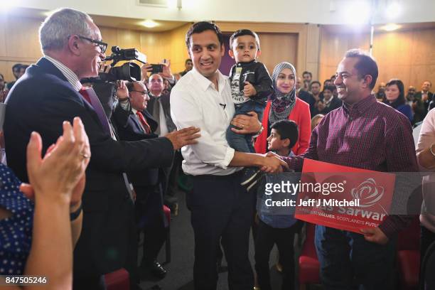 Anas Sarwar is seen with his family at the launch of his campaign to be Scottish Labour leader at the Gorbals Parish Church on September 15, 2017 in...