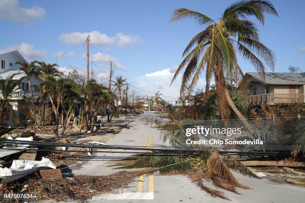 Trees and powerlines blown down by Hurricane Irma continue to block streets September 15, 2017 in Marathon, Florida. Many places in the Keys still...