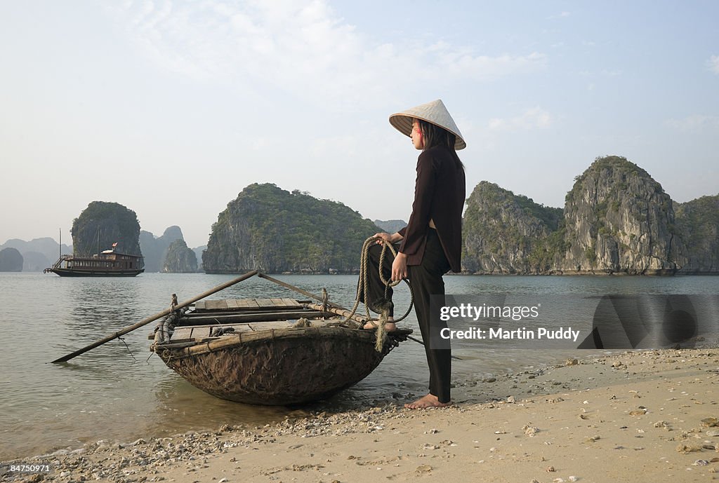 Vietnam,Halong Bay,Woman with Boat.