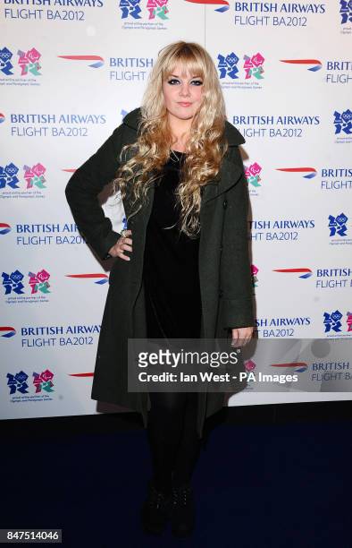 Goldilocks arrives at the airline themed pop-up venue Flight BA2012 on Shoreditch High Street in London.