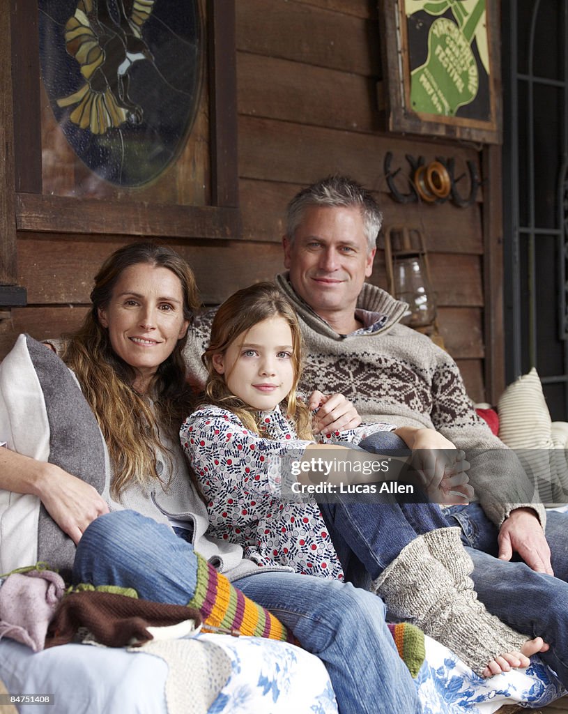 Family on porch outside country home