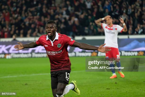 Hanover's Togolese forward Ihlas Bebou celebrate scoring the 2-0 goal during the German first division Bundesliga football match Hanover 96 vs...