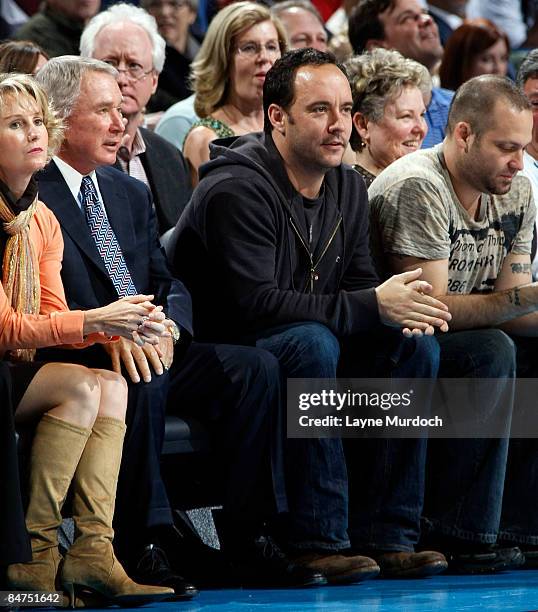 Musician Dave Matthews sits with New Orleans Hornets owner George Shinn and his wife Denise at the Hornets' game against the Boston Celtics on...