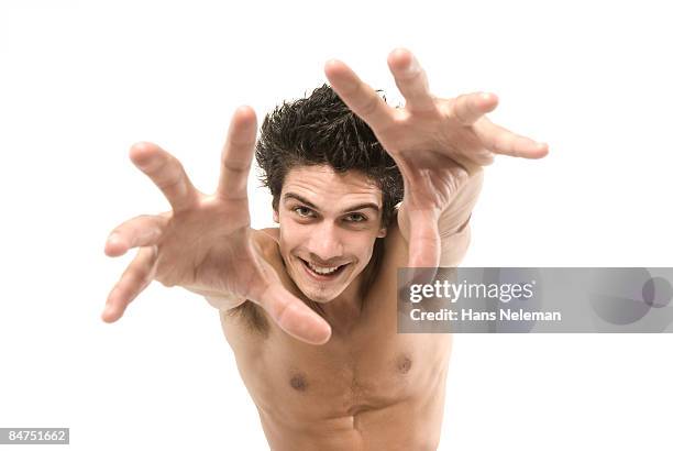 young man reaching toward us. - portrait of uruguay men stock pictures, royalty-free photos & images