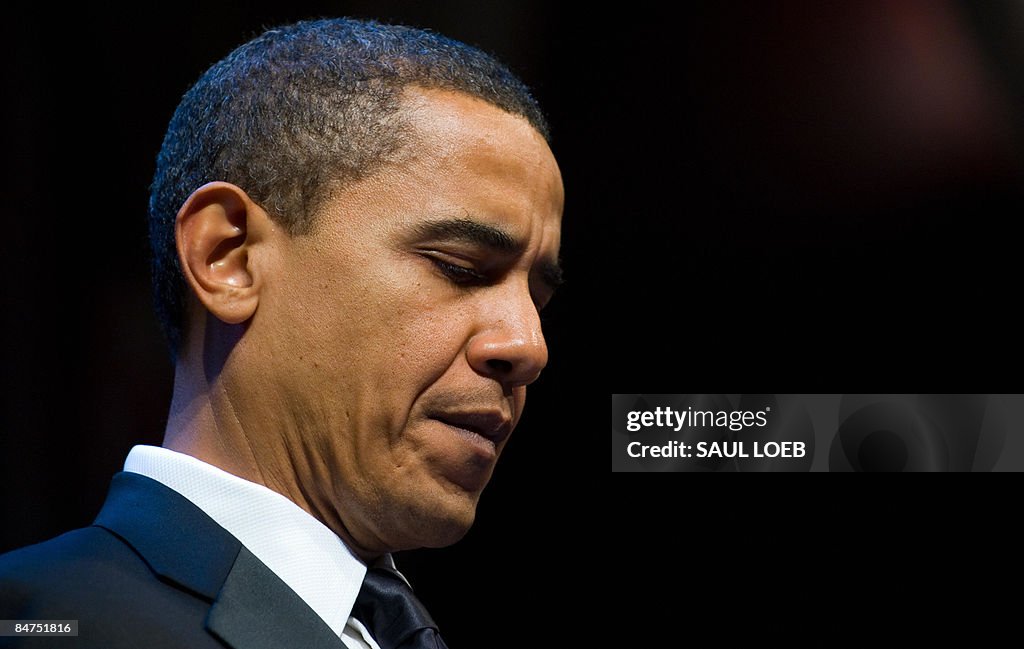 US President Barack Obama pauses while s
