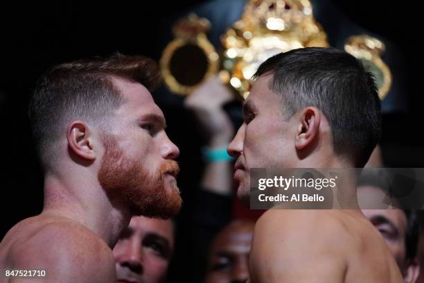 Boxer Canelo Alvarez and WBC, WBA and IBF middleweight champion Gennady Golovkin pose during their official weigh-in at MGM Grand Garden Arena on...