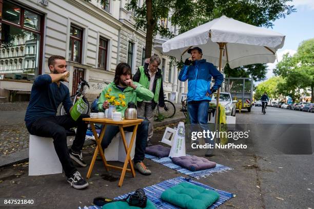 Greenpeace activists drink tea in a parking lot in Berlin, Germany, on 15 September 2017. In the annual worldwide action, artists, designers,...